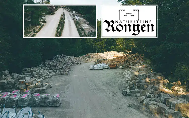 Natursteine Rongen - Natursteinpark mit gestapelten Natursteinen im Außenbereich von Natursteine Rongen, umgeben von Waldlandschaft